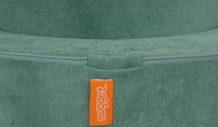 Video showing how the zipper tucks away on the hoop piece of a Chunk play ottoman.