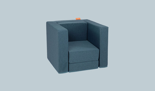 A Buckaroo dark-wash denim Smore play chair set up in a kids' chair configuration.