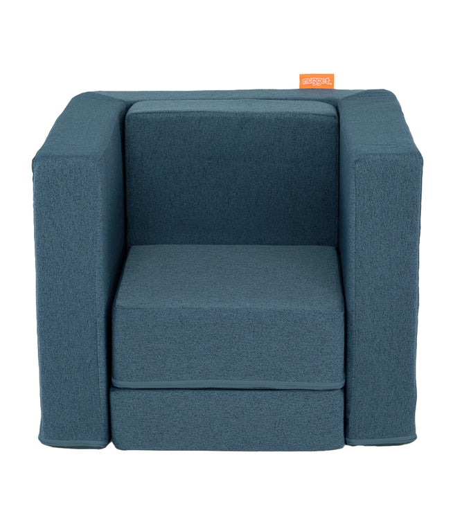 A Buckaroo dark-wash denim Smore play chair set up in a kids' chair configuration, which can be customized with an embroidered name.