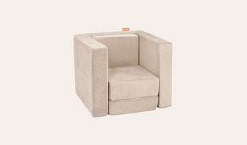 A Dunebuggy vintage beige Smore play chair set up in a kids' chair configuration.