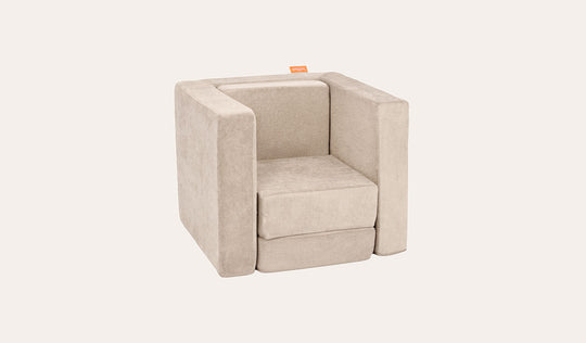 A Dunebuggy vintage beige Smore play chair set up in a kids' chair configuration.