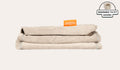 A neatly folded and stacked Smore Cover Set in vintage beige Dunebuggy.
