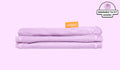 A neatly folded and stacked Smore Cover Set in lilac purple Moonshot.  
