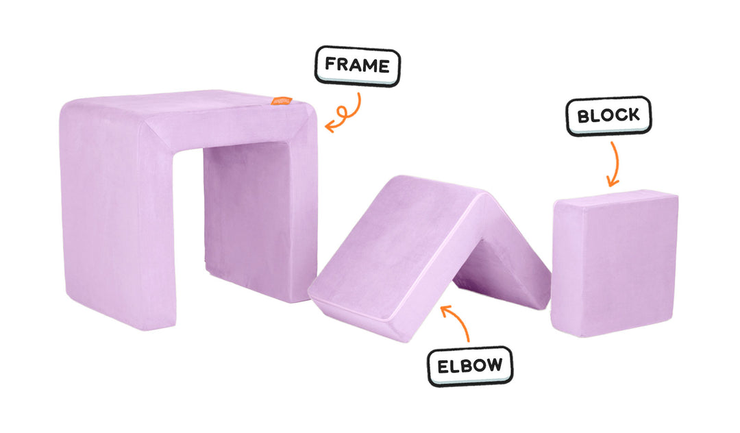 Four pieces of a lilac purple Smore play chair lined up: sturdy frame, one L-shaped elbow, and one square block.
