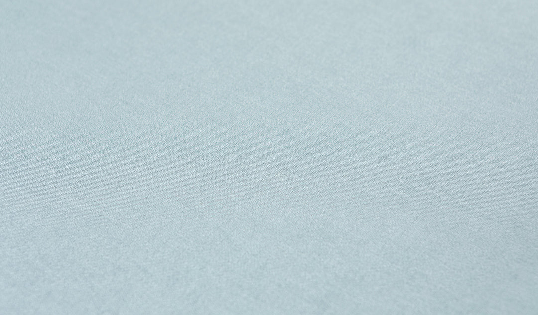 Close-up of the luxe texture of Nugget's double-brushed microsuede fabric in light gray-blue Surfside.