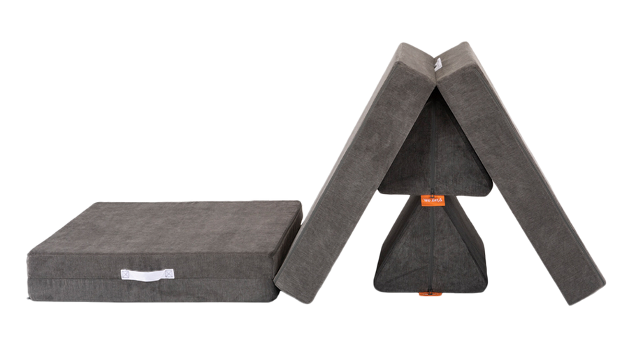 One charcoal gray Nugget play couch forms a Nugget obstacle course and mountain summit.