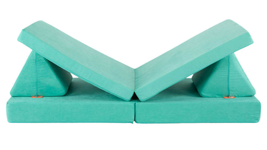 One minty green Nugget play couch forms a lounge build, with an elevated spot for one’s head and one’s feet.