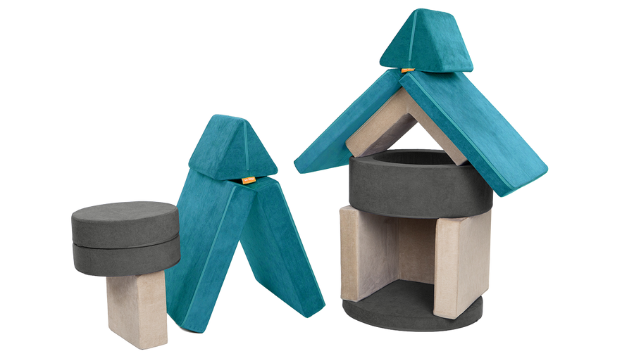 A playscape is arranged into three towers, made from a dark gray Chunk, teal Nugget, and beige Smore.