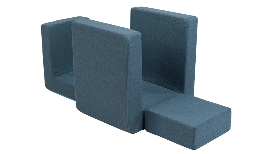 The three pieces of a denim Smore play chair are arranged to create a cozy nook for play.