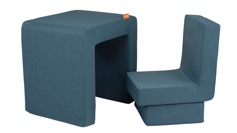 The three pieces of a denim Smore play chair are arranged to resemble a children's desk and chair.