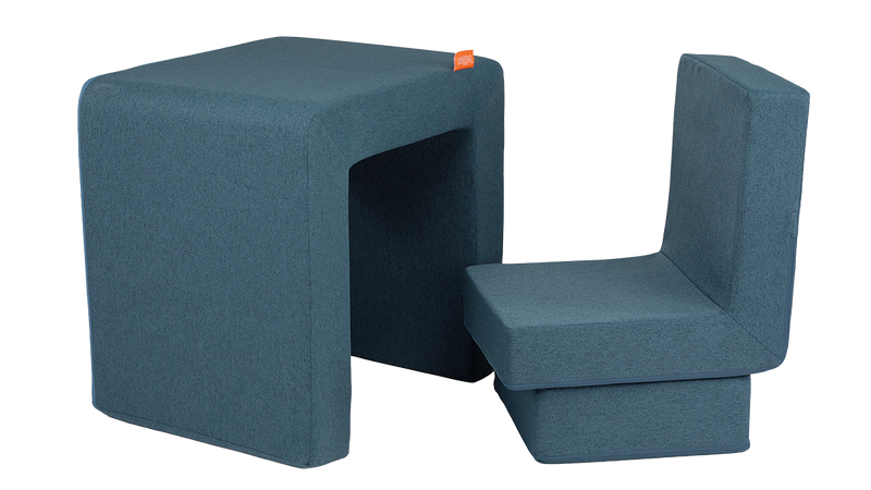 The three pieces of a denim Smore play chair are arranged to resemble a children's desk and chair.