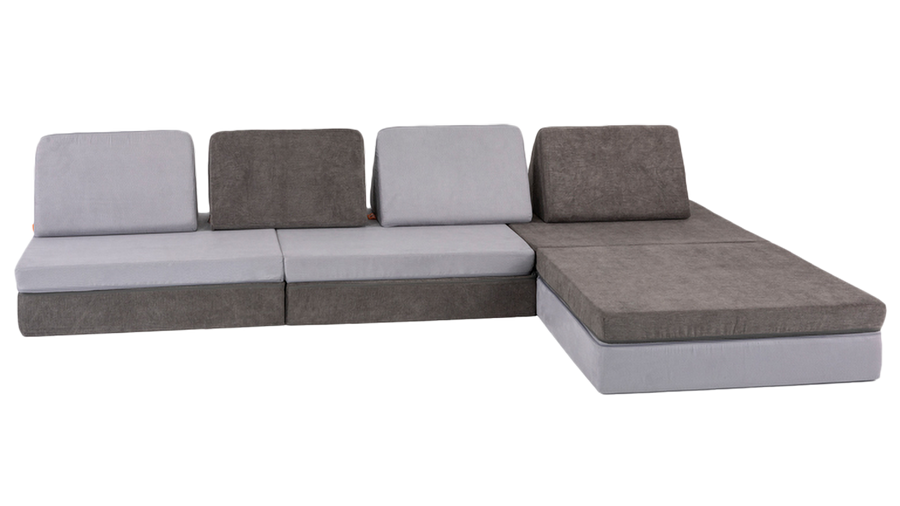 Two Nugget play couches are arranged to resemble a modern, family-friendly sectional couch. 