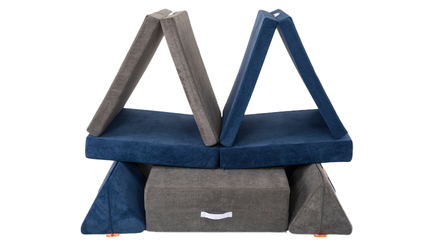 Two Nugget play couches are arranged as a fun fort with two separate rooms for imaginative play.