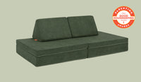 A Willow forest green Nugget play couch set up in a kids' sofa configuration.