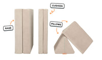 Four pieces of a vintage beige Nugget play couch lined up: one foldable base, one foldable cushion, and two triangular pillows.
